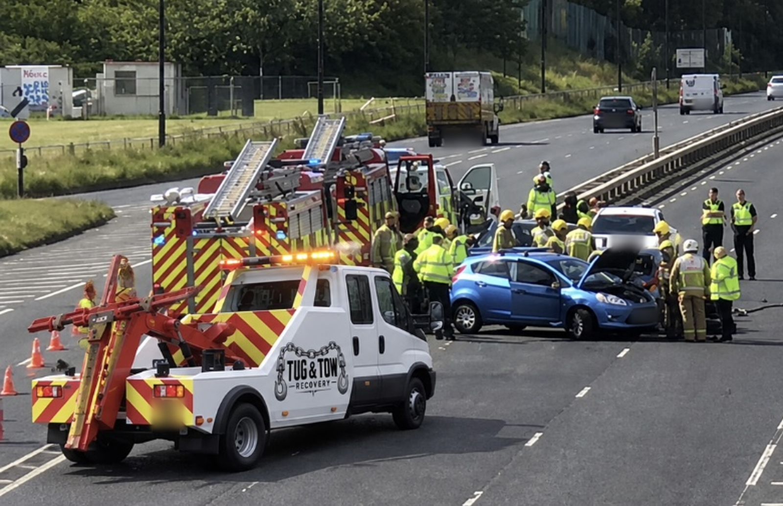 Tug & Tow Recovery truck at a motorway accident with fire and police crews